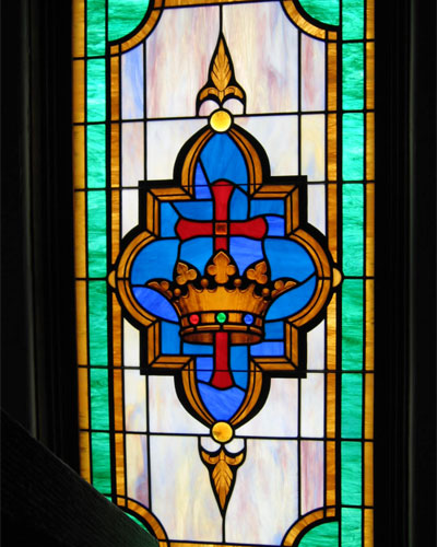Stair landing window with Cross-and-Crown motif
